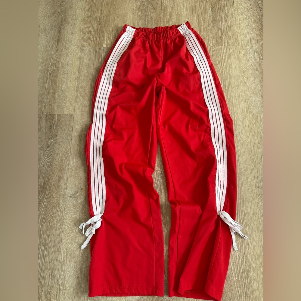 Red Track Pants with White Stripes